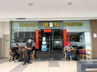 a group of people sitting in front of a restaurant at MALL OF ASIA 1156 Affordable Staycation DYNASTEL SHORE in Manila