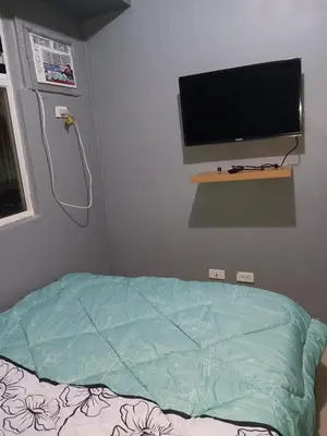 a hospital room with a bed and a flat screen tv at K2K place in Manila