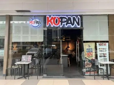 a no ram restaurant with tables and chairs in the window at STAR CITY 1148 DYNASTEL SHORE Staycation in Manila