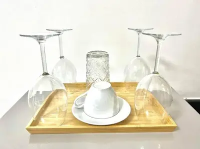 a wooden tray with four wine glasses and a teaucer at STAR CITY 1148 DYNASTEL SHORE Staycation in Manila