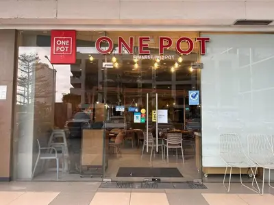 a one pot restaurant with a sign in the window at WORLD TRADE CENTER 959 DYNASTEL SHORE Staycation in Manila