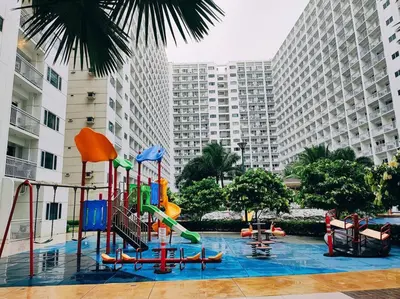 a playground in front of a large building at NAIA Pasay MOA 1250 Dynastel Shore Staycation in Manila