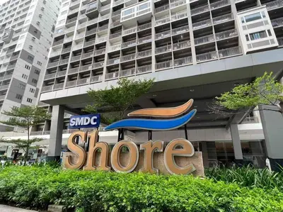 a store sign in front of a large building at NAIA Pasay MOA 1250 Dynastel Shore Staycation in Manila
