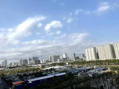 a view of a city with tall buildings at DYNASTEL SHORE 635 MOA Pasay Staycation in Manila