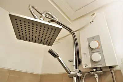 a shower in a bathroom in a room at SHORE RESIDENCES HOTEL Staycation 621 Dynastel in Manila