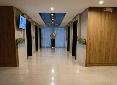 a hallway of a building with a television in it at MALL OF ASIA 774 DYNASTEL SHORE Staycation in Manila