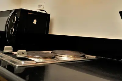 an apple computer sitting on top of a tray with coins at MALL OF ASIA 774 DYNASTEL SHORE Staycation in Manila