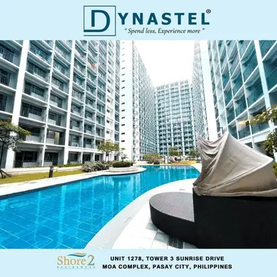 a magazine cover of a swimming pool in a city at NAIA AIRPORT MOA 1278 DYNASTEL SHORE Staycation in Manila