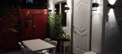 a room with a table and a door with plants at 6 Guest - Unit 2 Studio type in Santa Rosa