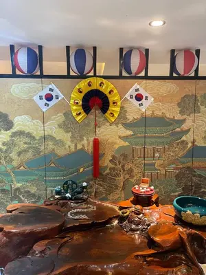 a room with a wall with a large mural with at Jjimjbang hotel spa in Manila