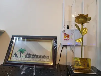 a picture of a palm tree in a frame on a table at SHORE 3 TOWER 1 Mall of Asia- Casa Sandique in Manila