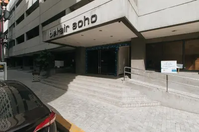 a building with steps in front of a building at RedDoorz at TJMG by Bel Air Polaris Makati in Manila