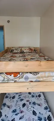 a bedroom with two bunk beds in a room at Arveelene Bedspacing in Manila