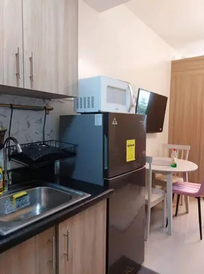a small kitchen with a sink and a microwave at Little Lux Condo Shore 2-T3 Improved in Manila
