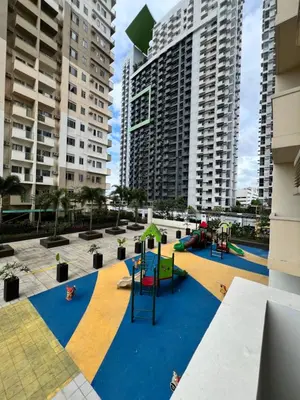 a playground in a city with tall buildings at Brand New Studio w/ Washer in Manhattan Plaza Tower ll in Manila