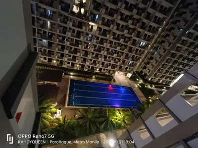 an overhead view of a large building with a swimming pool at Luxury 1 BR Suite Near NAIA in Manila