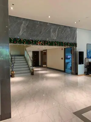 a lobby with a staircase and christmas decorations at 81 Newport Blvd Cluster 4 Unit B 3rd flr by Rechelle Nunag in Manila