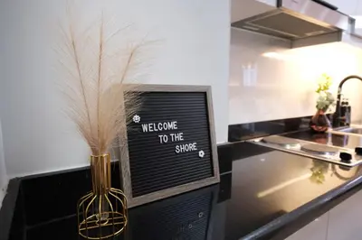 a vase on a counter with a welcome to the state sign at Modern Studio Condo near Mall of Asia & Airport, Shore 2 Residences in Manila