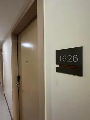 a sign on the side of a door in a building at Elane's Staycation -Mezza 2 1 br in Manila