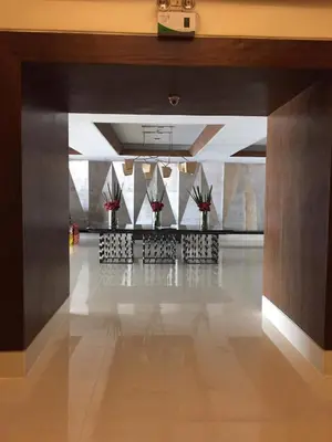 an empty lobby with plants in a building at Elane's Staycation -Mezza 2 1 br in Manila