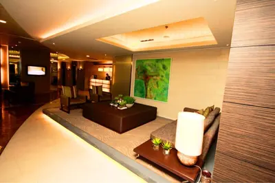 a living room with a couch and a table at Fully-furnished Condo Accommodation in Makati in Manila