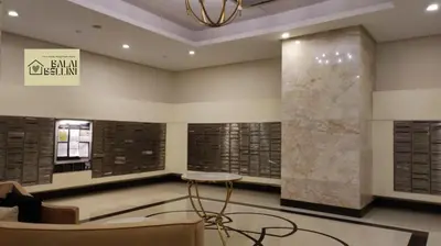 a lobby of a building with a table and chairs at Condo in McKinley Hill near Grand Canal Mall (Balai Bellini) in Manila