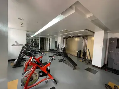 a gym with a bunch of bikes and exercise bikes at Condo in Malate Manila in Manila