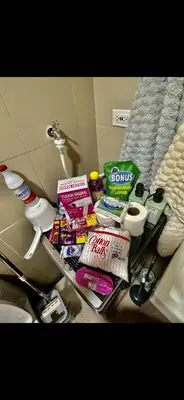 a shelf in a bathroom with toothbrushes and toiletries at Apartment Seaside Bliss in Manila