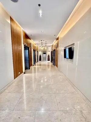 a hallway in a building with a large tile floor at Apartment Seaside Bliss in Manila