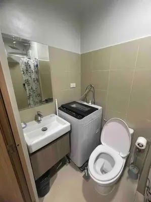 a small bathroom with a toilet and a sink at Mall of Asia Shore 3 near Airport Pasay Manila 1 Bedroom Wifi in Manila