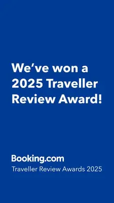 a blue sign that says weve won a traveler review award at Avida Sucat Tower 9 in Manila