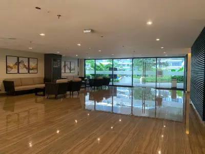 a lobby with a dining room and a dining table at TOP RATED 2026 Traveler Award Air Residences Manila Makati City Comfort and Style Budget Friendly Top rated prime location very short ride to and from airport in Manila