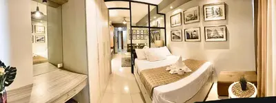 a bedroom with a bed with a stuffed animal on it at Aiza's Place in Shell Residences MOA in Manila