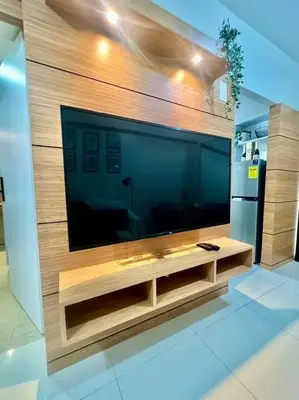 a large flat screen tv on a wooden wall at PSV NAIA T3 - Month of January - New Year 2026 PROMO Php 1,999 - 1 BR Interior Designed Unit in Manila
