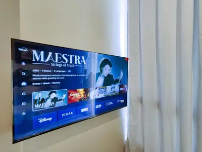 a flat screen tv hanging on a wall at 1BR Condotel Suite at Sunshine100 City Plaza #SS01 in Manila