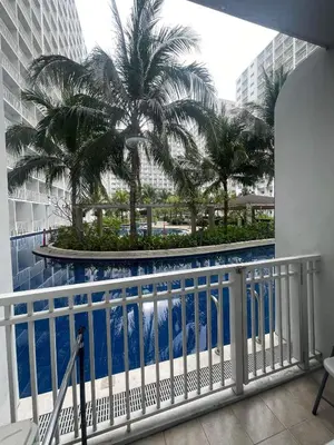 a view of a pool from the balcony of a hotel at Shore Residence Mall of Asia Direct pool in Manila