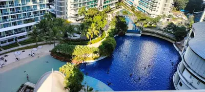 an aerial view of a river in a city with buildings at Staycation at Azure Urban Resorts in Manila