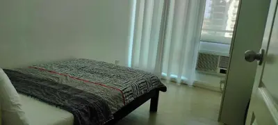 a small bed in a room with a window at Staycation at Azure Urban Resorts in Manila