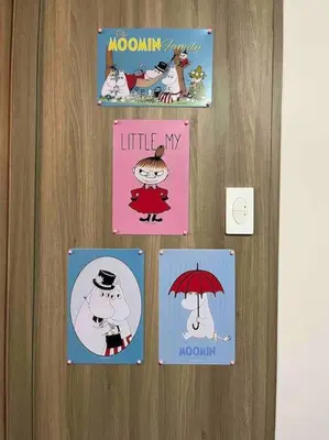 a door with four pictures of cartoons on them at Coast of Finland: Stunning Manila Bay & Sunset in Manila