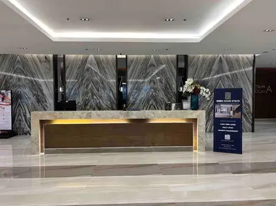 a lobby with a bench in the middle of a building at Coast of Finland: Stunning Manila Bay & Sunset in Manila