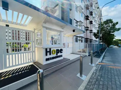 a building with a sign that says hope on it at Amiela’s Place in Trece Martires