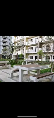 a group of benches in front of a building at The Atherton in Manila