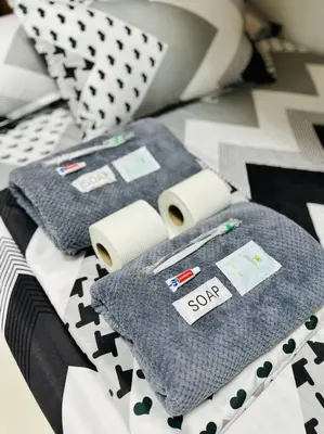 a bed with two towels and some pillows on it at Makati Staycation by Marco - SMDC Lush in Manila
