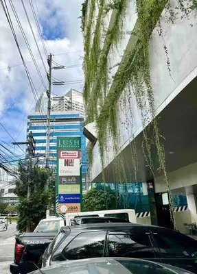 a group of cars parked in front of a building at Makati Staycation by Marco - SMDC Lush in Manila