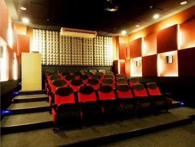 an auditorium with red chairs in a theatre at The Beacon Makati in Manila
