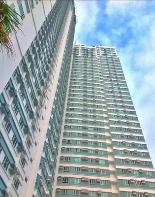 a large tall building with many windows at The Beacon Makati in Manila
