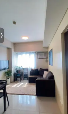 a living room with a couch and a table at The Beacon Makati in Manila
