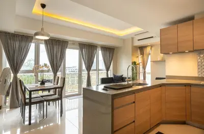 a kitchen and dining room with a table and chairs at Luxury Condo at Venice Mall near Airport, BGC & Makati in Manila