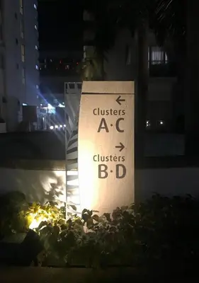 a sign that reads clusters a c clusters bd at Condo 1 Palm Tree Across NAIA T3 in Manila
