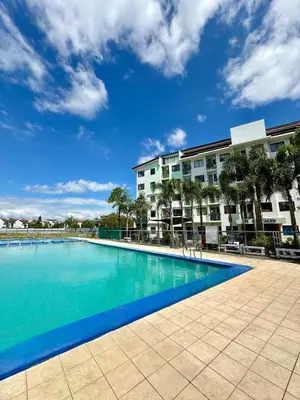 a large swimming pool in front of a building at Zen Haven Staycation beside EK in Santa Rosa